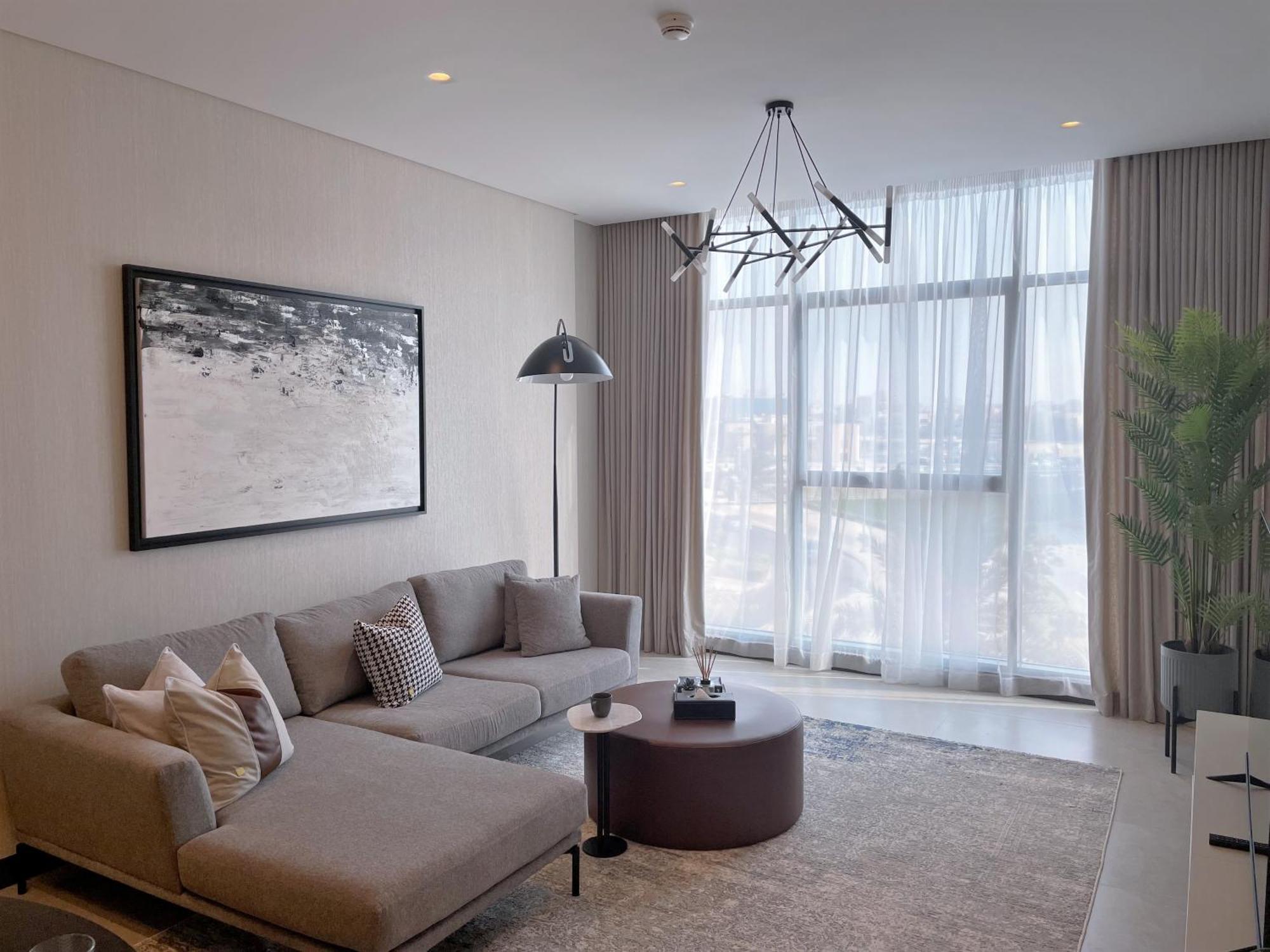 Hotel Charthouse Bahrain Manama Exterior foto A living room in a typical apartment